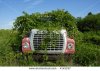 stock-photo-abandoned-flatbed-truck-overgrown-with-weeds-4145257.jpg